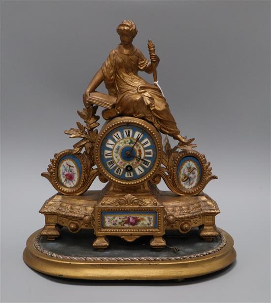 An early 20th century porcelain spelter mantel timepiece